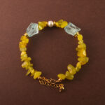 Handmade Virgo bracelet featuring peridot, aquamarine, and pearl beads in a serene and balanced design.