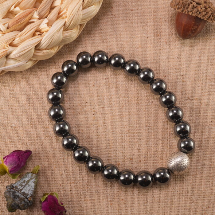 Hematite bracelet in natural light showing glossy dark grey tones.
