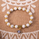 Howlite evil eye bracelet in daylight showing clean tones.