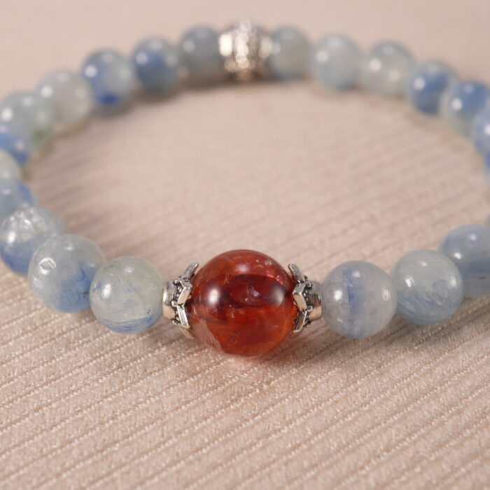 Close-up of kyanite and red agate bracelet with vivid colors.
