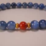 Close-up of kyanite and red agate bracelet.