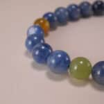 Close-up of kyanite and red agate bracelet.