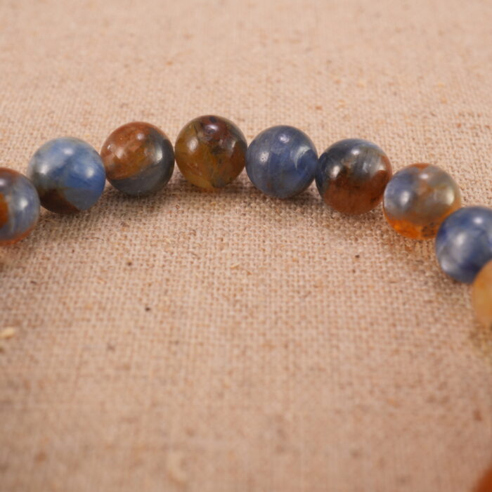 Close-up of kyanite bracelet with S925 silver accents.