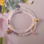 Full view of the lavender and Uruguayan amethyst necklace laid flat, showing the arrangement of beads for convertible styling.