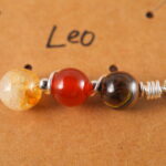 Detailed view of Leo necklace featuring tiger eye, red jasper, and citrine.