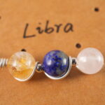 Close-up of Libra necklace showing citrine, lapis lazuli, and clear quartz beads.