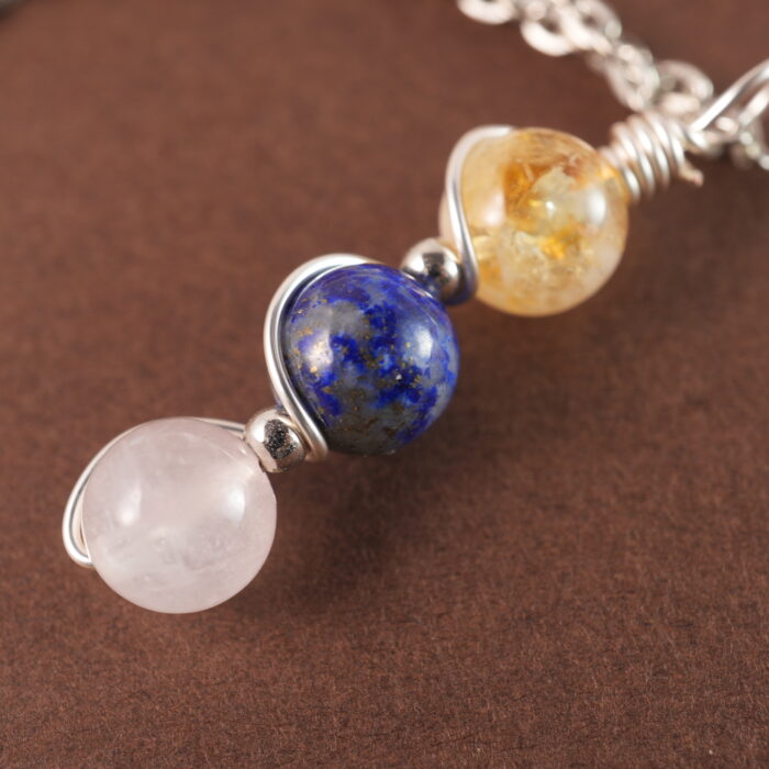 Close-up of Libra necklace showing citrine, lapis lazuli, and clear quartz beads.