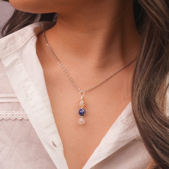 Model wearing Libra zodiac necklace with citrine, lapis lazuli, and clear quartz.