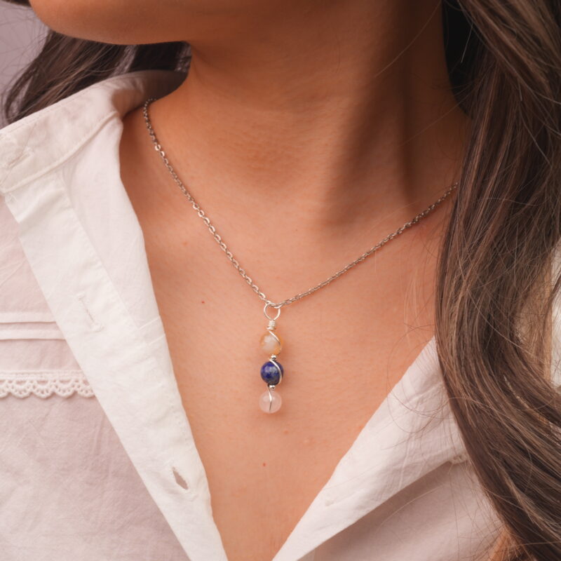 Model wearing Libra zodiac necklace with citrine, lapis lazuli, and clear quartz.