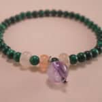 Close-up of malachite and amethyst bracelet.
