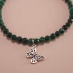 Close-up of malachite and rhodochrosite bracelet with silver.