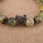 Close-up of moss agate bracelet with S925 silver spacers.