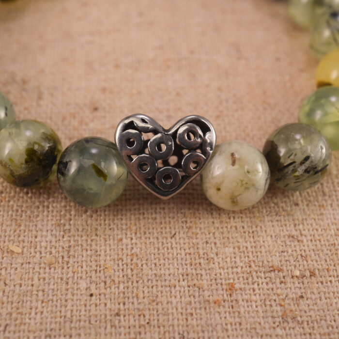 Close-up of moss agate bracelet with S925 silver spacers.