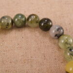 Close-up of moss agate bracelet with S925 silver spacers.