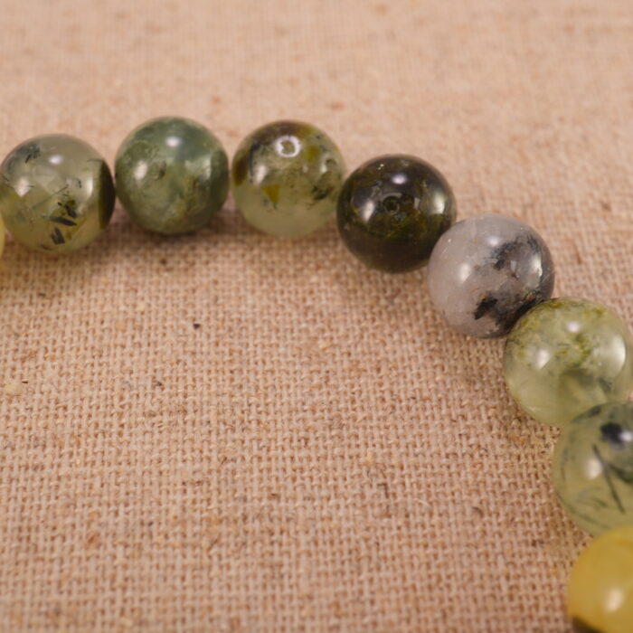 Close-up of moss agate bracelet with S925 silver spacers.
