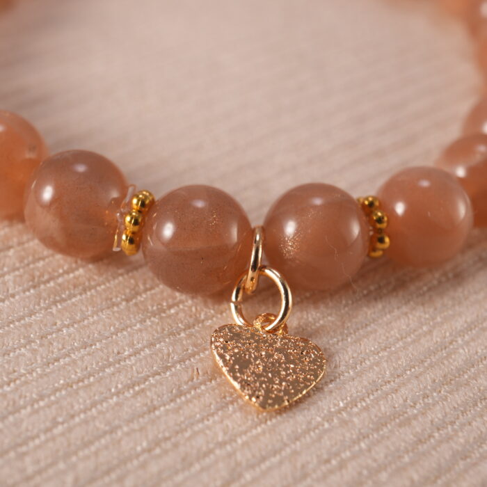 Close-up of peach moonstone bracelet.