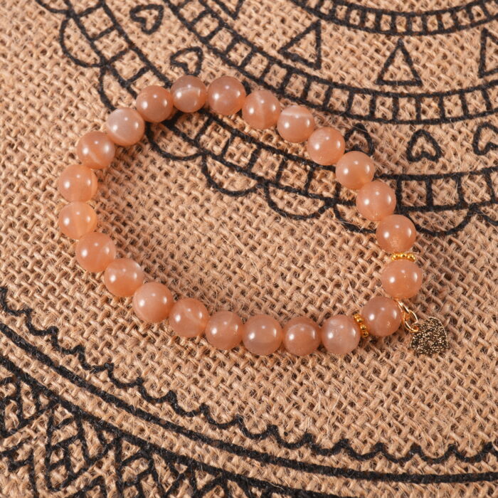 Peach moonstone bracelet in daylight showing soft shimmer.