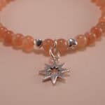 Close-up of peach moonstone bracelet with silver.