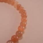 Close-up of peach moonstone bracelet with silver.