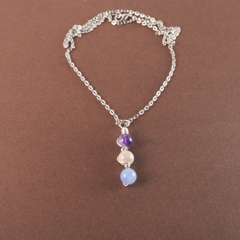 Pisces zodiac necklace with amethyst, crazy agate, and aquamarine gemstones.