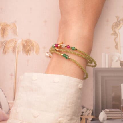 Prehnite bracelet wrapped three times around the wrist, offering a calming and elegant layered look.