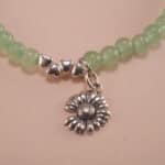 Close-up of prehnite bracelet with silver accent.