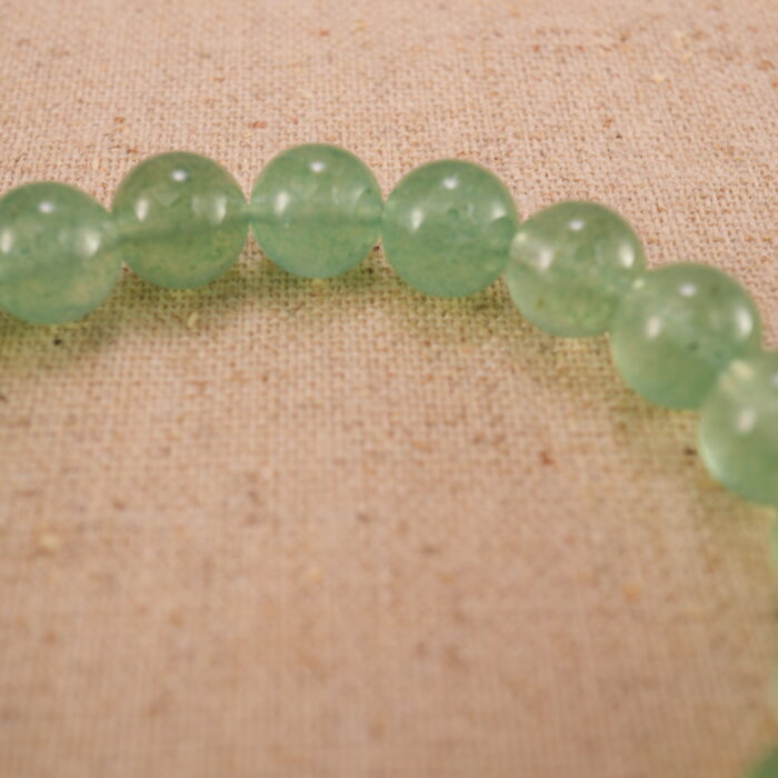 Close-up of prehnite bracelet with S925 silver beads.