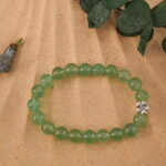 Prehnite bracelet in natural light with soft green translucency.