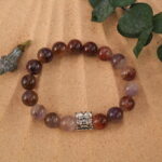Purple phantom bracelet in natural light showing layered crystal textures.