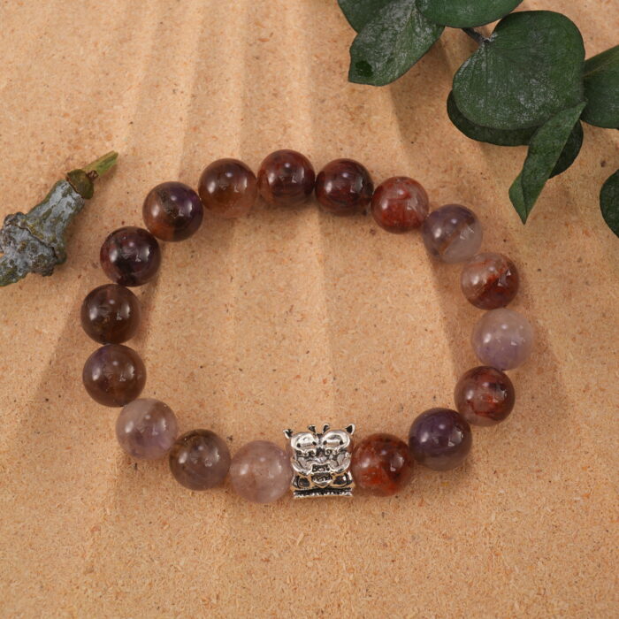 Purple phantom bracelet in natural light showing layered crystal textures.