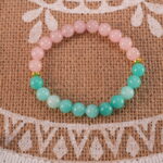 Natural light photo highlighting pink and aqua gemstone tones.