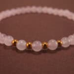 Close-up of rose quartz bracelet.