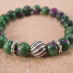 Close-up of ruby in zoisite bracelet with S925 silver accent beads.