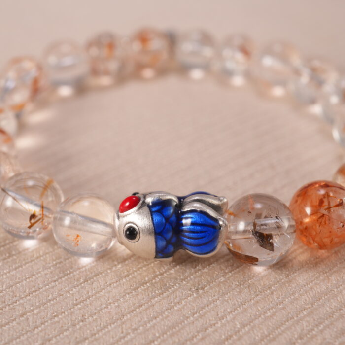 Close-up of rutilated quartz bracelet with S925 silver accents.