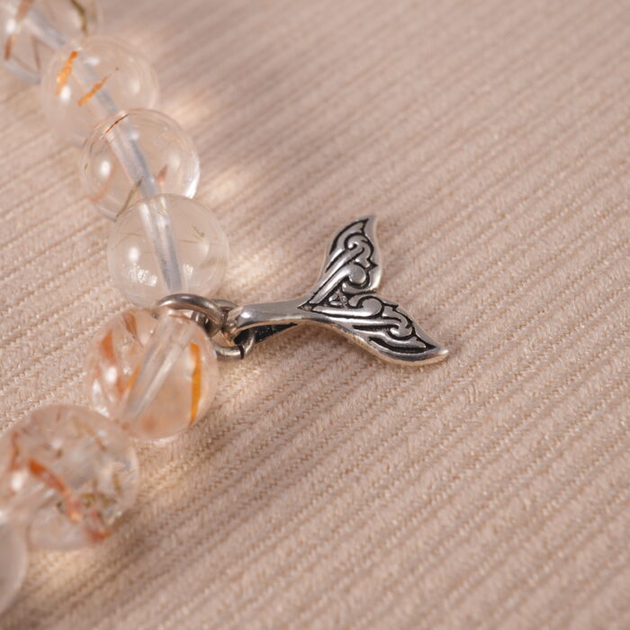 Close-up of rutilated quartz bracelet with golden inclusions and S925 accents.