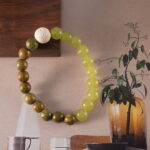Sandalwood bracelet in natural light with earthy tones.
