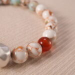 Close-up of Shoushan stone bracelet with sterling silver accents.