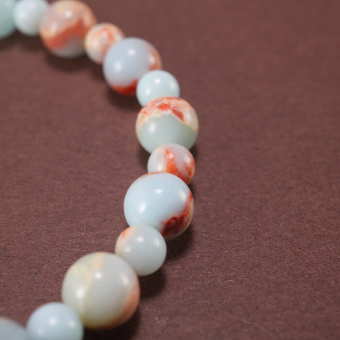 Close-up of shoushan stone bracelet with S925 silver accents.