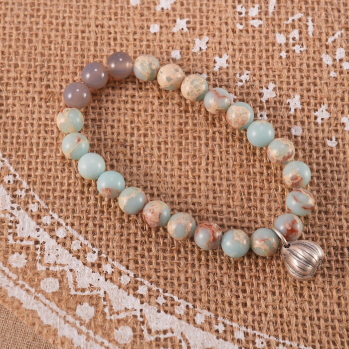 Shoushan stone bracelet in natural light, warm tones visible.