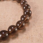 Close-up of smoky quartz bracelet with S925 silver beads.