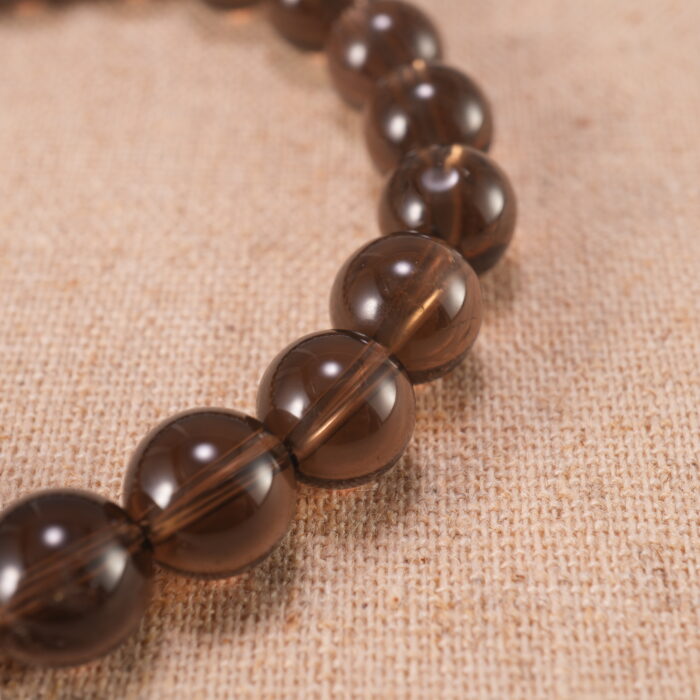 Close-up of smoky quartz bracelet with S925 silver beads.