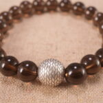 Close-up of smoky quartz bracelet with S925 silver components.