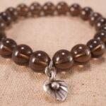 Close-up of smoky quartz bracelet with S925 silver beads.