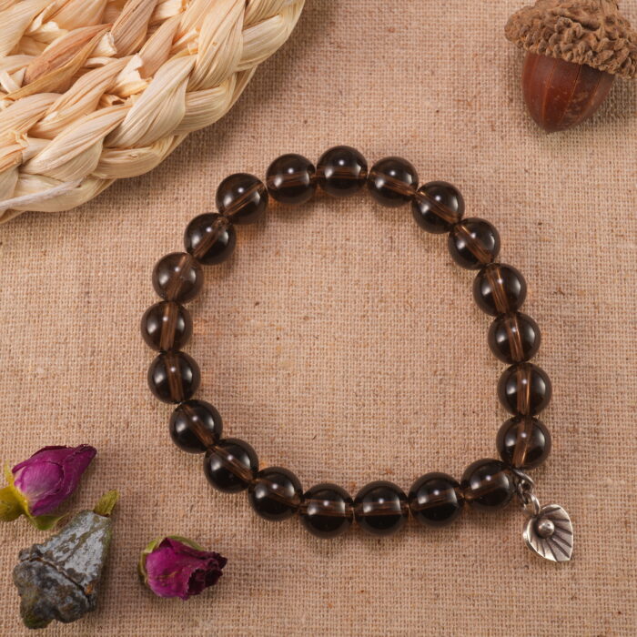 Smoky quartz bracelet in natural light showing soft smoky hues.