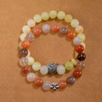 Main image of stacked Afghan jade and moonstone bracelets as a set.