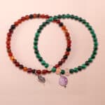 Main image of stacked flower red agate, malachite, and amethyst bracelets.