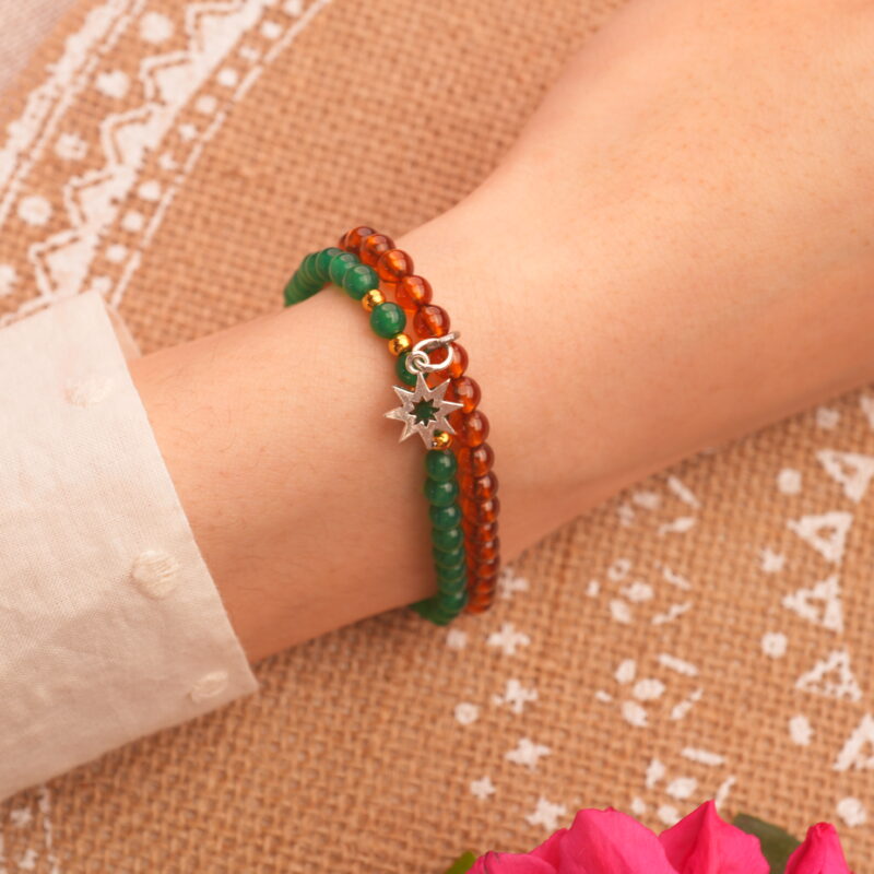 Model wearing garnet and green chalcedony stack.