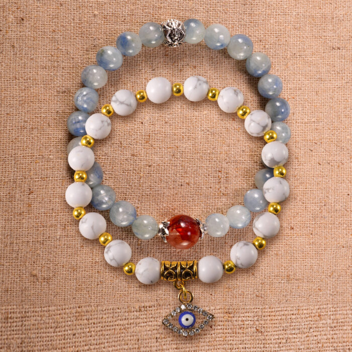 Main image of stacked bracelets in kyanite, red agate, and howlite.