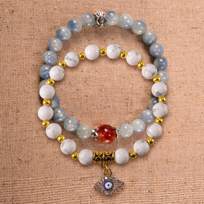 Main image of stacked bracelets in kyanite, red agate, and howlite.