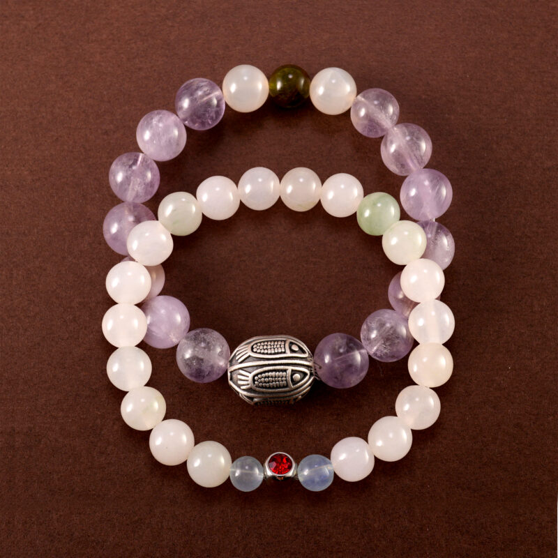 Main image of stacked bracelets: lavender amethyst, chalcedony and ruby.